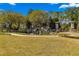 Stone Creek community entrance showcasing a scenic water feature, lush greenery, and elegant signage at 7274 Sw 95Th Ave, Ocala, FL 34481