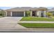 Charming single-story home with a well-maintained lawn and a two car garage at 7274 Sw 95Th Ave, Ocala, FL 34481