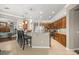 Open concept kitchen with modern appliances, pendant lighting, and a convenient breakfast bar at 7274 Sw 95Th Ave, Ocala, FL 34481