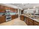 Modern kitchen featuring stainless steel appliances, granite countertops, and ample cabinet space at 7274 Sw 95Th Ave, Ocala, FL 34481
