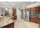 Well-equipped kitchen with stainless steel appliances, granite countertops, and a breakfast bar at 7274 Sw 95Th Ave, Ocala, FL 34481