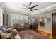 Open living space featuring hardwood floors, and a view into the kitchen at 7274 Sw 95Th Ave, Ocala, FL 34481
