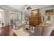 Cozy living room with stylish furniture, hardwood floors, and natural light from shuttered windows at 7274 Sw 95Th Ave, Ocala, FL 34481