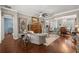 Bright living room featuring hardwood floors, stylish furniture, and an open layout at 7274 Sw 95Th Ave, Ocala, FL 34481