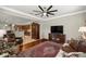 Comfortable living room with hardwood floors, stylish furniture, and an open view to the modern kitchen at 7274 Sw 95Th Ave, Ocala, FL 34481