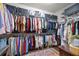 Organized walk-in closet offering ample storage with shelving and hanging space at 7274 Sw 95Th Ave, Ocala, FL 34481