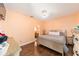 Cozy bedroom with hardwood flooring, neutral walls, a modern bed frame and dresser at 2648 Ne 24Th Pl, Ocala, FL 34470