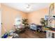 Bright bedroom with dark wood flooring, a ceiling fan, and a window with blinds at 2648 Ne 24Th Pl, Ocala, FL 34470