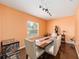 Bright dining area featuring a modern wooden table under track lighting, perfect for Gathering meals at 2648 Ne 24Th Pl, Ocala, FL 34470