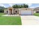 Lovely one-story home boasting a two-car garage and a beautifully maintained front yard at 2648 Ne 24Th Pl, Ocala, FL 34470