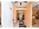 Inviting foyer with tile flooring, arched doorway and decor at 2648 Ne 24Th Pl, Ocala, FL 34470
