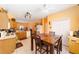 Spacious kitchen with tile flooring, wooden cabinets and a dining table, perfect for Gathering gatherings at 2648 Ne 24Th Pl, Ocala, FL 34470