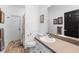 Bright bathroom with a modern sink and wood-look flooring at 23510 Oak Prairie Cir, Sorrento, FL 32776
