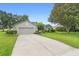 Charming single Gathering home featuring an attached two car garage and long driveway at 23510 Oak Prairie Cir, Sorrento, FL 32776