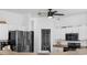 Modern kitchen boasts white cabinets, stainless steel appliances, and ample counter space at 23510 Oak Prairie Cir, Sorrento, FL 32776
