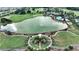Beautiful community featuring a pristine lake, golf course, and lush greenery at 5237 Nw 48Th Pl, Ocala, FL 34482