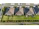 An aerial view of the back of the house, showcasing the backyard, lawn, and community landscaping at 5237 Nw 48Th Pl, Ocala, FL 34482