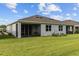 Grassy backyard with a screened lanai, ideal for entertaining and outdoor enjoyment at 5237 Nw 48Th Pl, Ocala, FL 34482