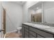 Bright bathroom featuring a double vanity, granite countertop, and a glass-enclosed shower at 5237 Nw 48Th Pl, Ocala, FL 34482