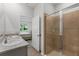 Bathroom with granite countertop, dual sinks, and tiled walk-in shower at 5237 Nw 48Th Pl, Ocala, FL 34482