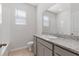 Bright bathroom features granite countertop with double sinks and a shower/tub combination at 5237 Nw 48Th Pl, Ocala, FL 34482