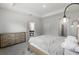 Bedroom with neutral walls, carpet, and modern light fixture at 5237 Nw 48Th Pl, Ocala, FL 34482