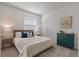 Bright bedroom with natural light, features stylish furnishings and decor, including accent pillows and bedside lamps at 5237 Nw 48Th Pl, Ocala, FL 34482