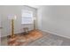 Bedroom with a large window, neutral carpet, and gold accent lamps and décor at 5237 Nw 48Th Pl, Ocala, FL 34482