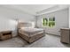 Bedroom with neutral walls, carpet, and a window letting in lots of natural light at 5237 Nw 48Th Pl, Ocala, FL 34482