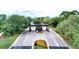Paver entry to community features lush landscaping and a manned entry gate at 5237 Nw 48Th Pl, Ocala, FL 34482