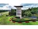 Striking monument sign at Ocala Preserve entrance with colorful landscaping at 5237 Nw 48Th Pl, Ocala, FL 34482
