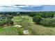 Scenic aerial of Ocala Preserve golf course, featuring pristine greens and mature trees at 5237 Nw 48Th Pl, Ocala, FL 34482
