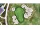 Aerial view of the manicured golf course with sand traps surrounding the green at 5237 Nw 48Th Pl, Ocala, FL 34482