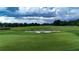 Golf course with a sand trap surrounding the green in the Ocala Preserve community at 5237 Nw 48Th Pl, Ocala, FL 34482
