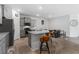 Open kitchen boasts granite countertops, stainless steel appliances, and breakfast bar at 5237 Nw 48Th Pl, Ocala, FL 34482