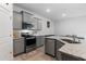 This kitchen features a stainless steel range, gray cabinets, granite countertops, and stainless dishwasher at 5237 Nw 48Th Pl, Ocala, FL 34482