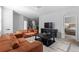 Open-concept living room with tile flooring seamlessly connects to dining and kitchen at 5237 Nw 48Th Pl, Ocala, FL 34482