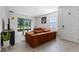 Bright living room with an oversized couch and tile flooring at 5237 Nw 48Th Pl, Ocala, FL 34482