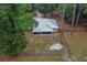Home with a metal roof, screened in porch, fenced yard, and basketball court at 3005 Se 156Th Place Rd, Summerfield, FL 34491