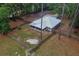 Aerial view of a home with basketball court, metal roof, and screened in porch at 3005 Se 156Th Place Rd, Summerfield, FL 34491