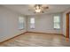 Unfurnished bedroom featuring neutral walls and wood-look floors at 3005 Se 156Th Place Rd, Summerfield, FL 34491