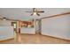 Open floor plan with tile flooring into kitchen with wooden cabinets at 3005 Se 156Th Place Rd, Summerfield, FL 34491