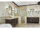 Beautiful bathroom with double vanity, large shower with glass door and marble tile at 1157 Hollow Pine Dr, Oviedo, FL 32765