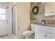 Bathroom features a modern vanity, decorative mirror and light fixture, and a step-in shower at 1157 Hollow Pine Dr, Oviedo, FL 32765