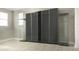 Spacious bedroom showcasing modern gray wardrobes and display cabinets, offering ample storage and style at 1157 Hollow Pine Dr, Oviedo, FL 32765
