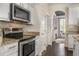 Well-equipped kitchen featuring stainless steel appliances, granite countertops, and ample storage space at 1157 Hollow Pine Dr, Oviedo, FL 32765