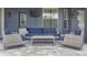 Relaxing screened-in patio with outdoor seating, mini fridge, and mounted TV at 1157 Hollow Pine Dr, Oviedo, FL 32765