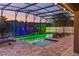 Spectacular screened pool featuring spa area, water fountain, and colorful accent lights at 1157 Hollow Pine Dr, Oviedo, FL 32765