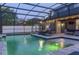 Magnificent screened-in pool and patio area featuring accent lights and outdoor seating at 1157 Hollow Pine Dr, Oviedo, FL 32765