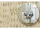 Detailed shot of Moen shower control with decorative tile background at 1157 Hollow Pine Dr, Oviedo, FL 32765